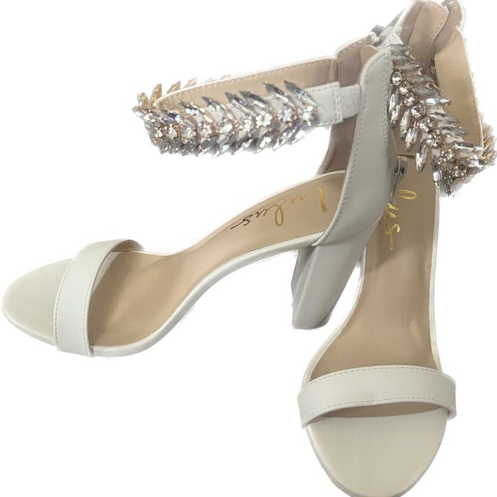 Lulu’s brand new, never worn, in box Mylan heels.